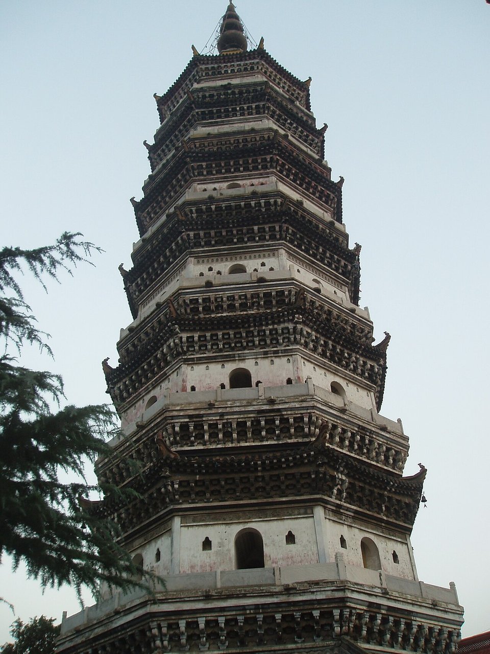 Seven storey octagonal Zhenfeng Pagoda with layered eaves against a pale sky