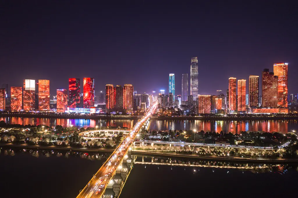 The Changsha skyline at night from the Xiang River, with Orange Isle in the foreground