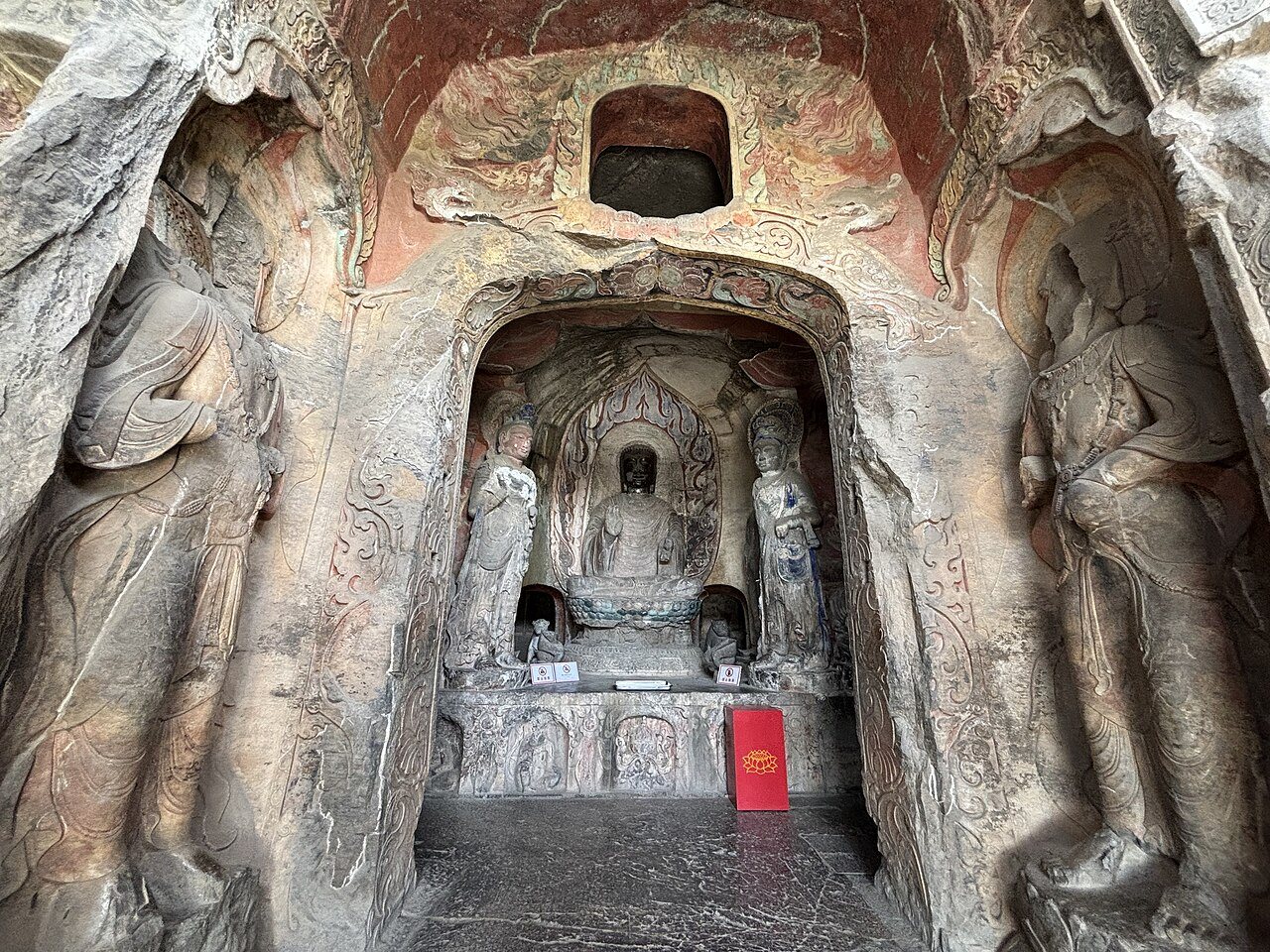 Carved niche with Buddha figures and guardian reliefs at Xiangtangshan