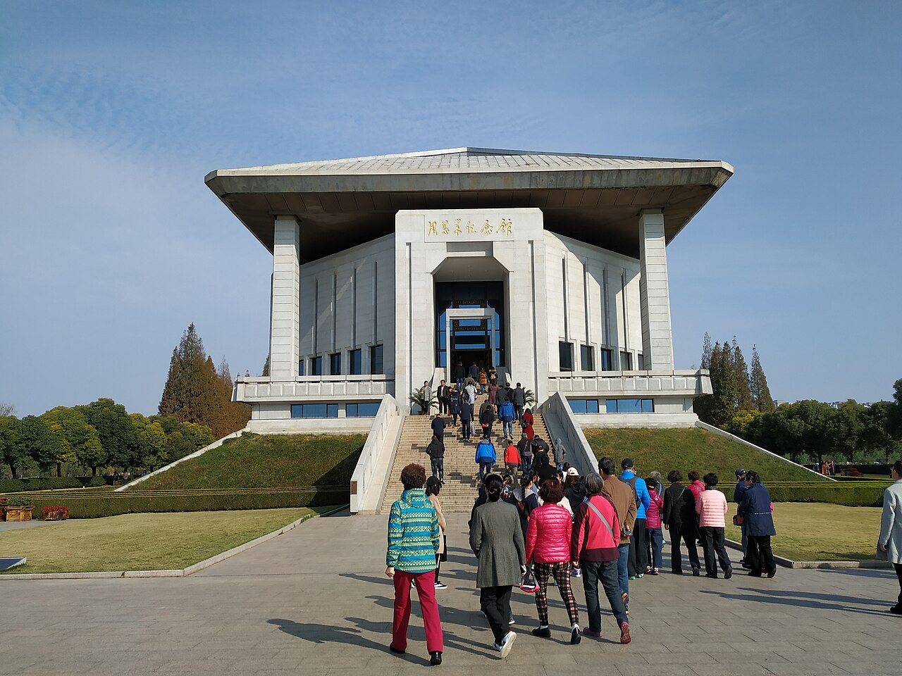 Main building of the Zhou Enlai Memorial Hall in Huai'an with visitors on the steps