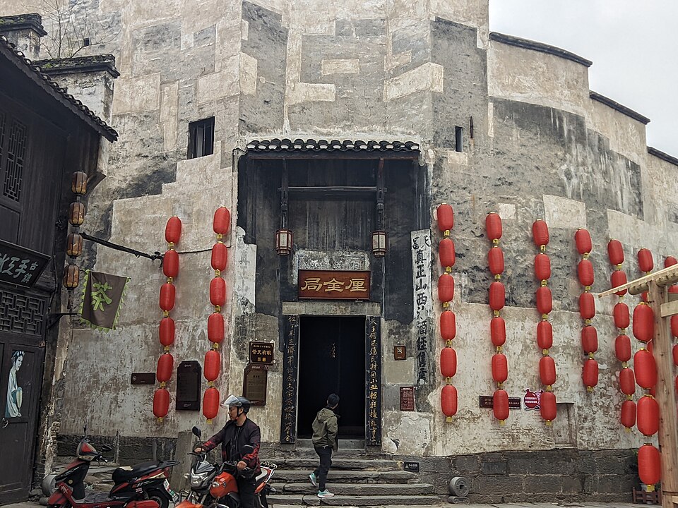 Stone-paved lane between high walls in Hongjiang old town