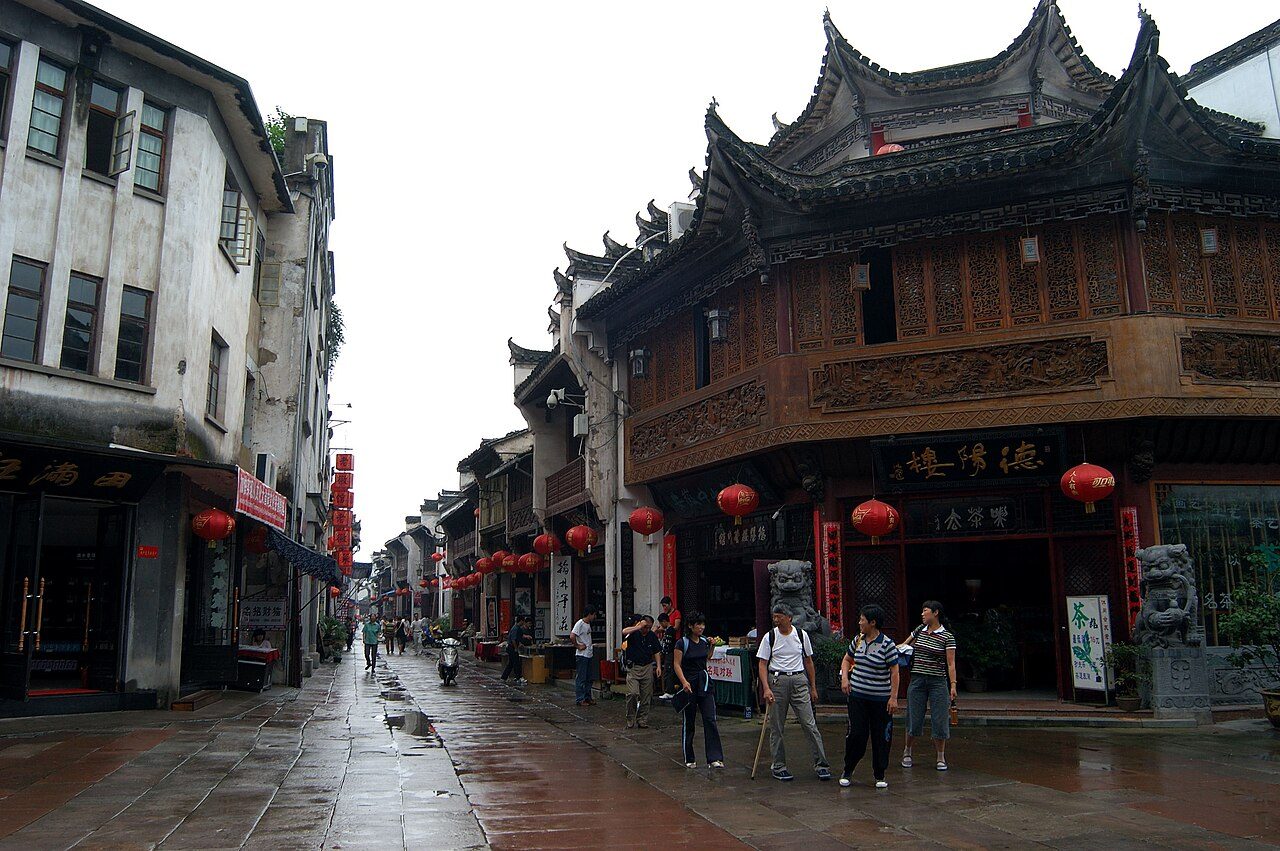Two-storey shopfronts and paving stones along Tunxi Old Street