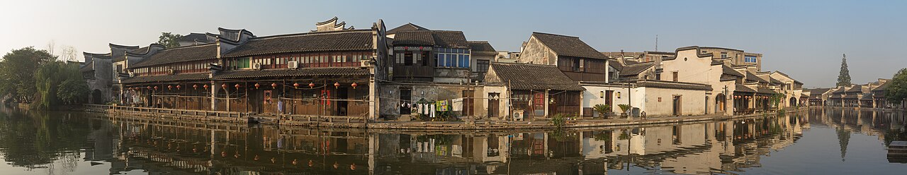 Wide panorama of canals and rooftops in Nanxun ancient town