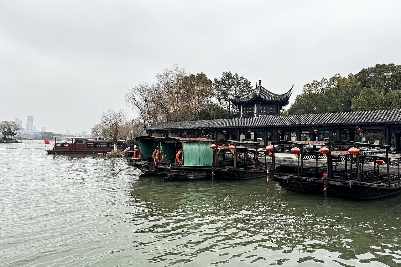 Boats moored under willows on South Lake, Jiaxing