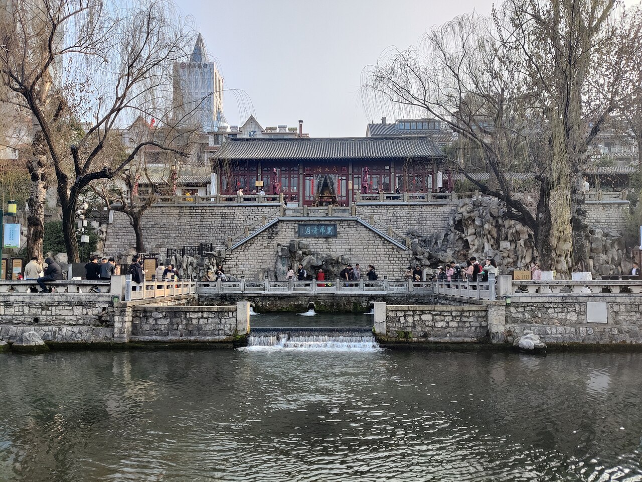 Water pouring from the stone tiger heads at Black Tiger Spring, Jinan