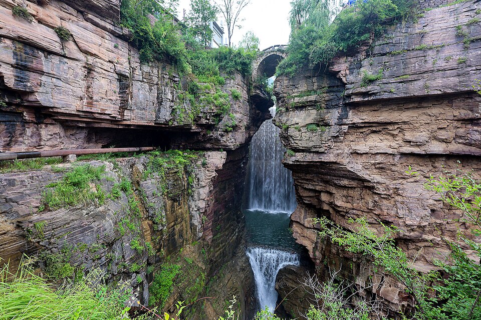 Narrow road cut into a sheer cliff face at Xiyagou in the Taihang Mountains
