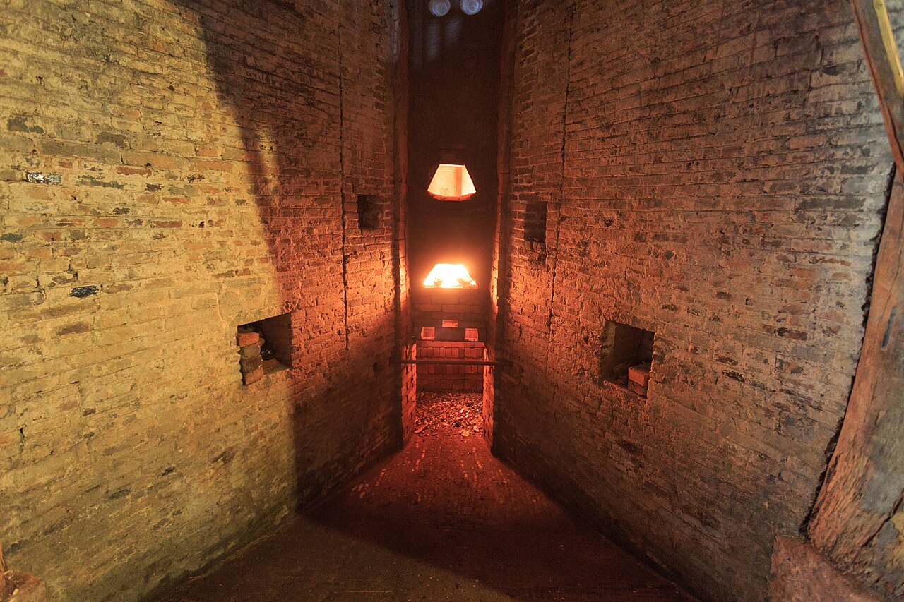 inside the brick firing chamber of the Zhen kiln, lit from within