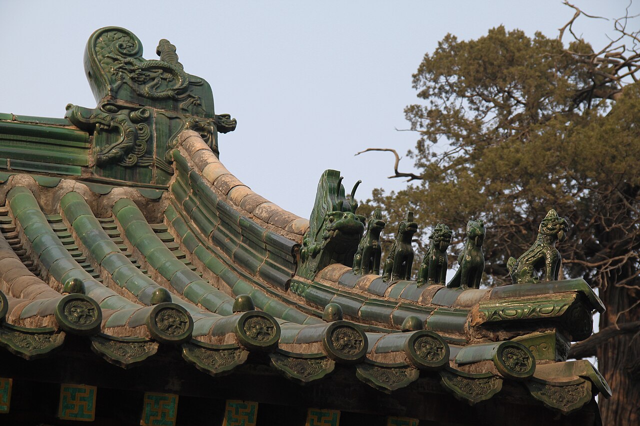 Carved dragon column and painted eaves at the Confucius Temple in Qufu