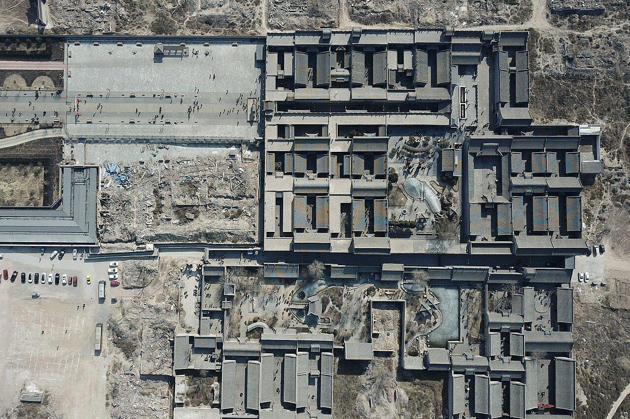 Aerial view of the Qiao Family Compound showing its grid of grey courtyards and roofs