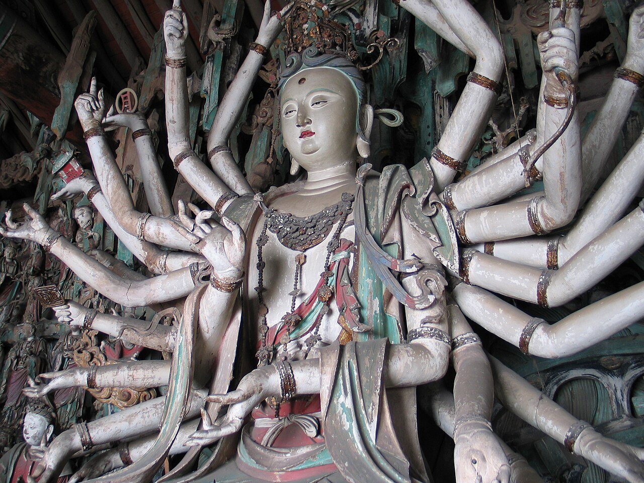 Painted clay Guanyin with many arms at Shuanglin Temple
