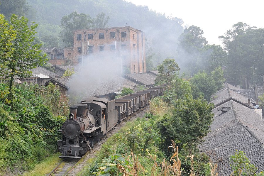 Jiayang C2 steam locomotive number 07 with smoke rising
