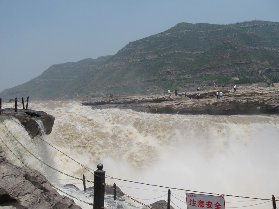 Spray rising from the gorge below Hukou Waterfall between loess cliffs