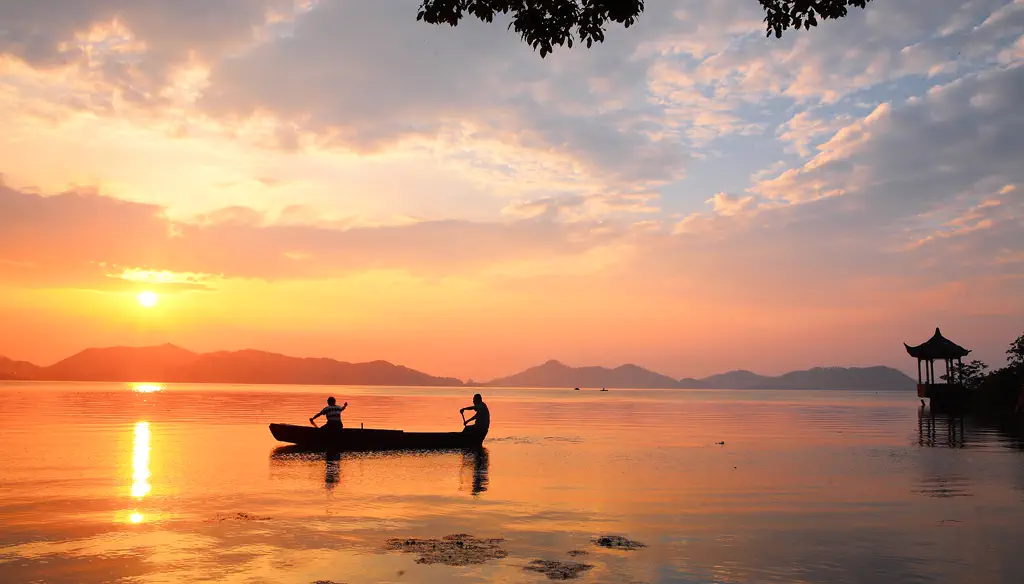 Rowboats on Dongqian Lake at dusk