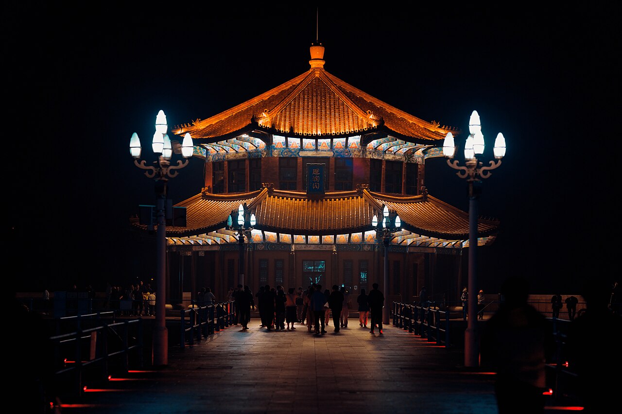 Huilan Pavilion lit up at night at the end of Zhanqiao Pier