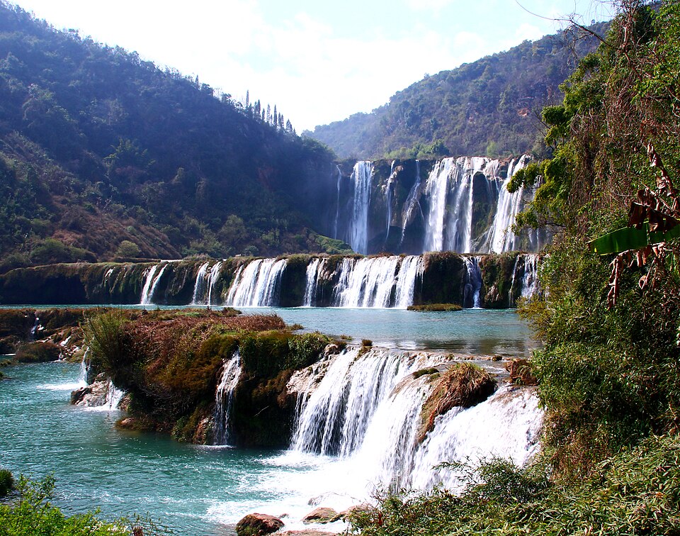 Wide tiered cascade of the Jiulong Waterfalls in Luoping, Yunnan