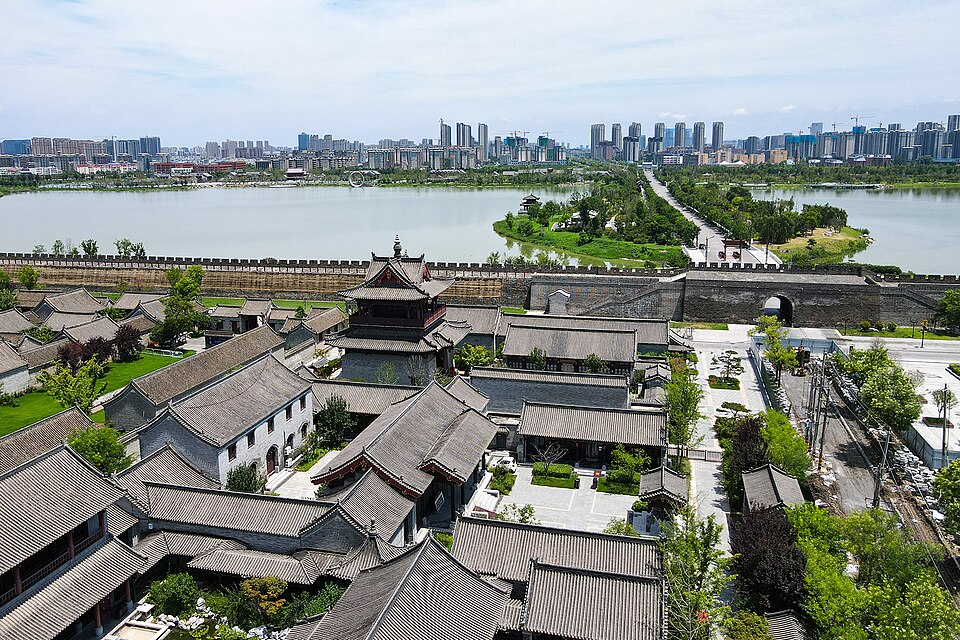 Brick city wall of Shangqiu rising above the lake that surrounds it
