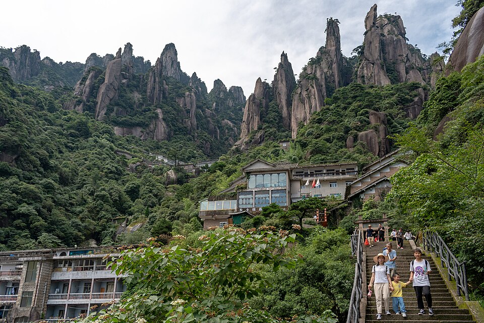 Walkway fixed to a sheer cliff face on Mount Sanqing in mist