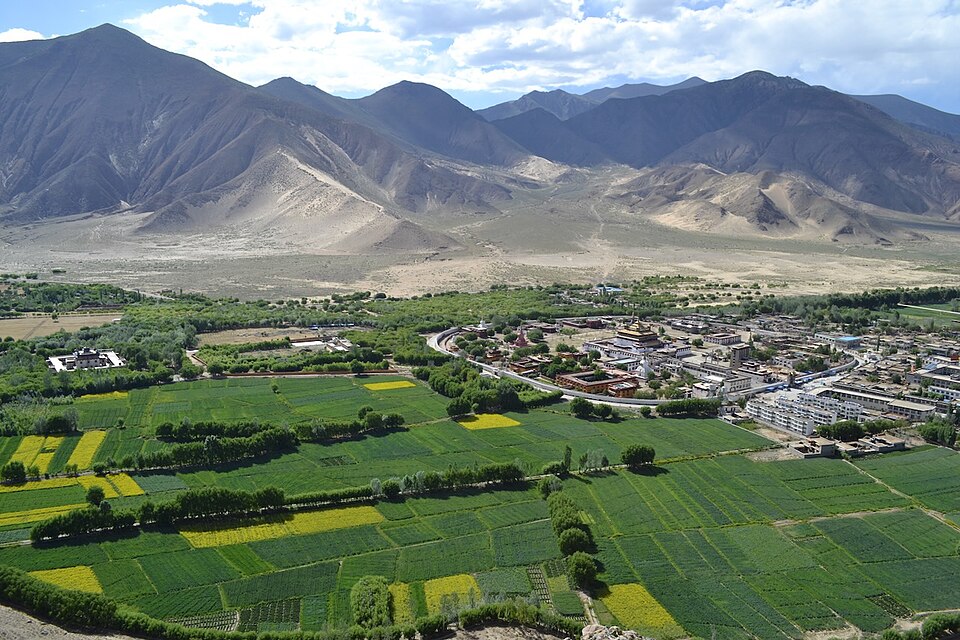Aerial view of Samye Monastery's circular wall and central hall in mandala layout