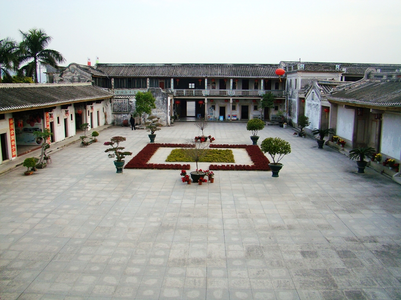 Courtyard of the Chen Cihong Residence with arched Western windows and Chaoshan roofs