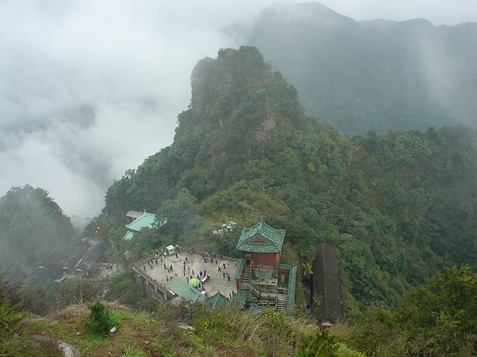 Halls and terraces of a Wudangshan Taoist temple on a forested slope