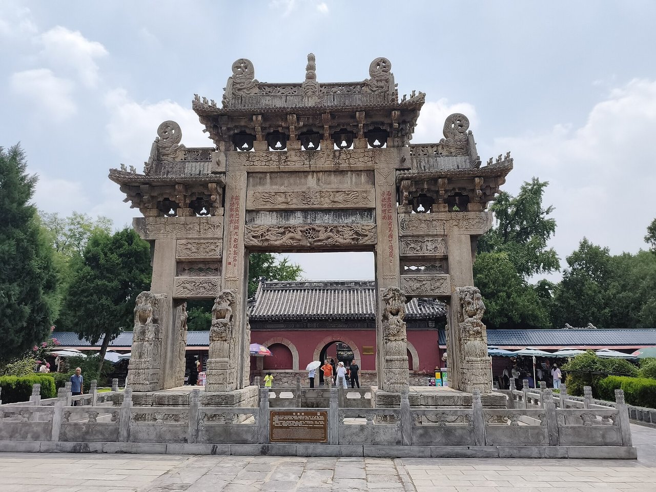 The carved stone Dai Temple archway in front of the temple walls