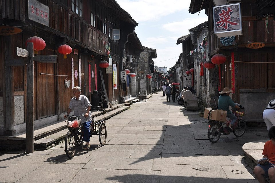 Old two storey wooden shopfronts with lanterns along Ziyang Street in Linhai