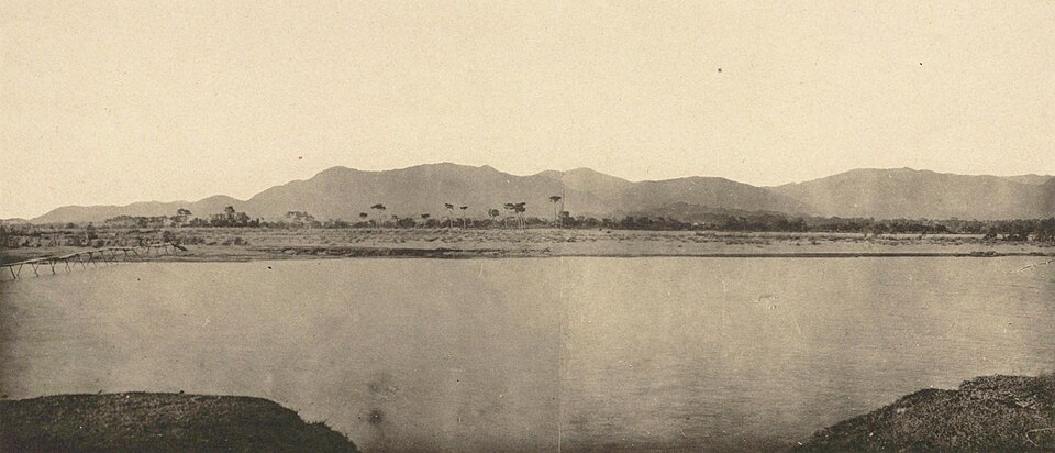 Early photograph of the Tiantai Mountain range seen across a flat river plain