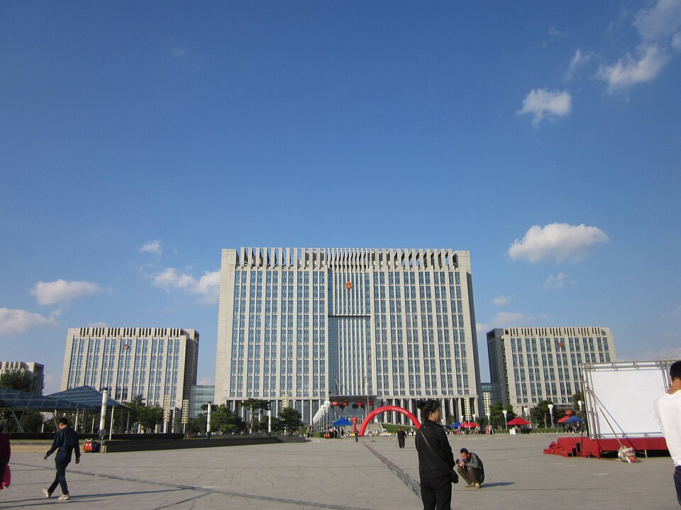 Wide plaza and modern government buildings under a blue sky in Tieling New City