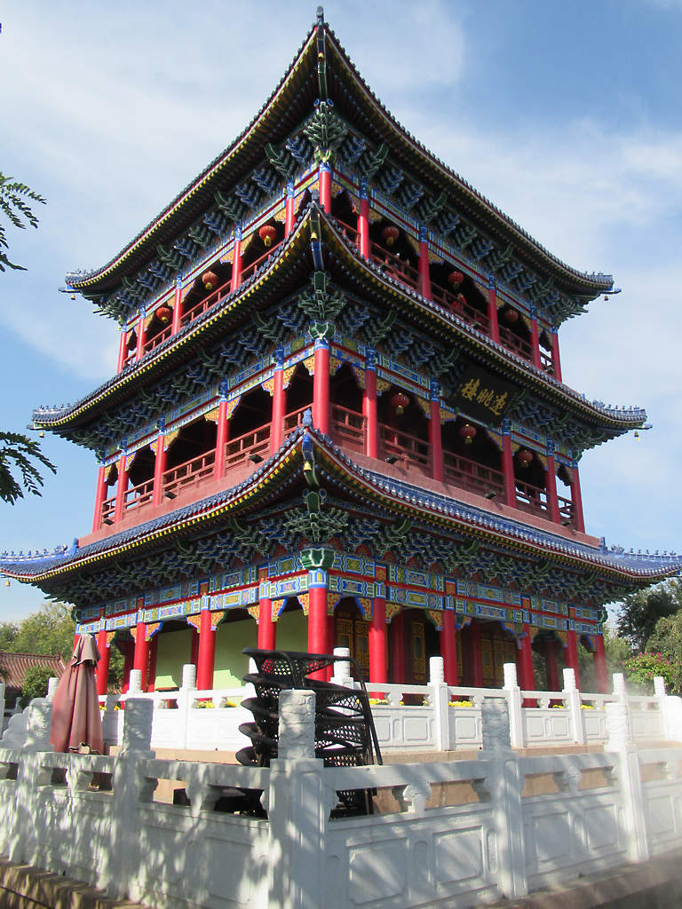 Brick Zhenlong Pagoda on top of Red Hill in Urumqi with the city below