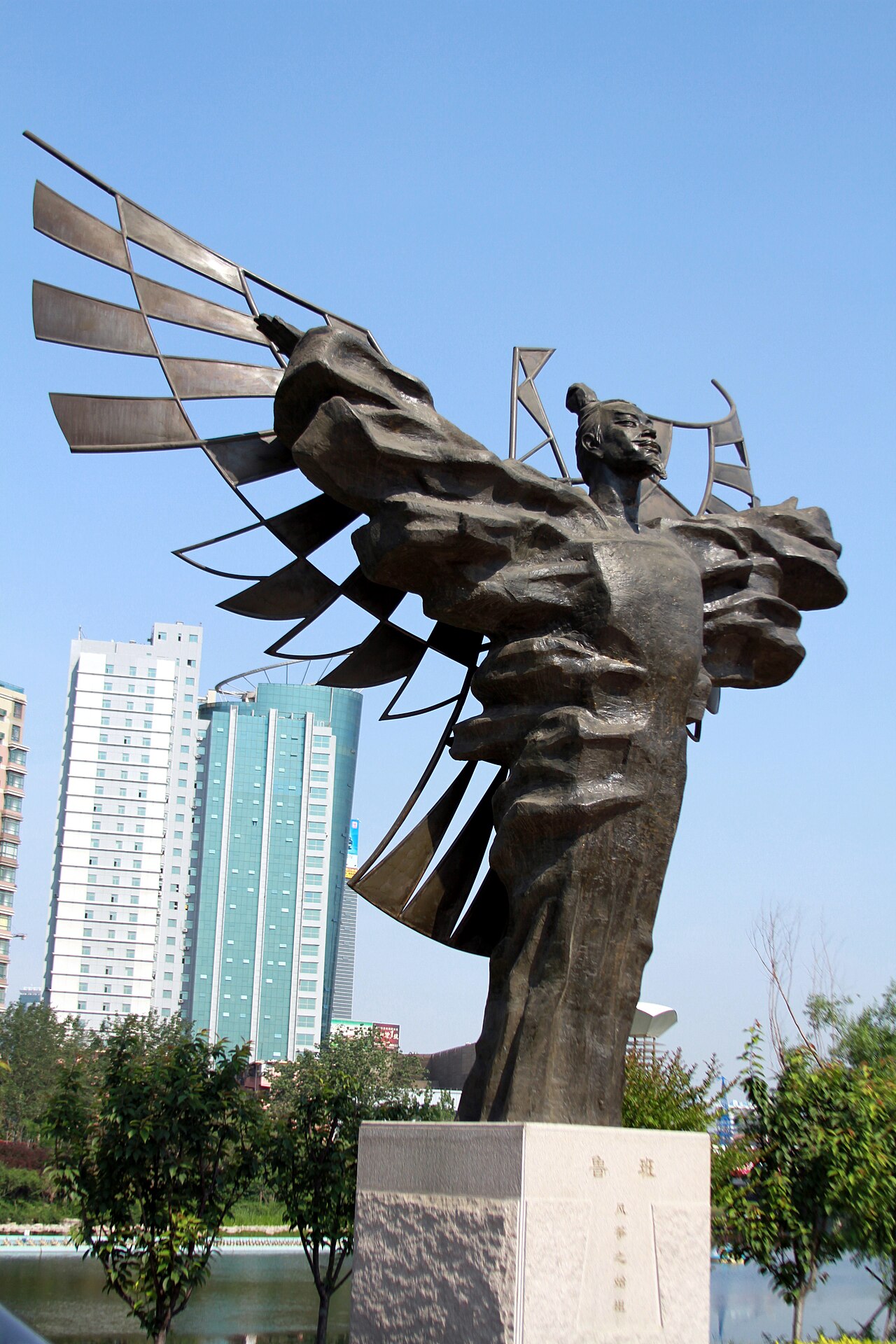 Bronze statue of Lu Ban with outspread wooden-bird wings in Weifang