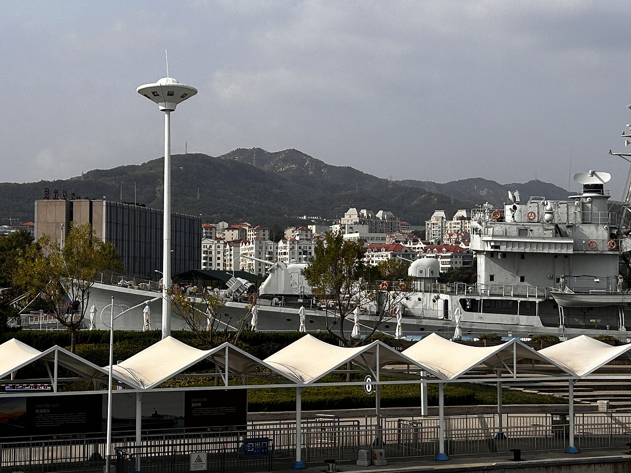 White passenger ferries moored at the Weihai pier for Liugong Island