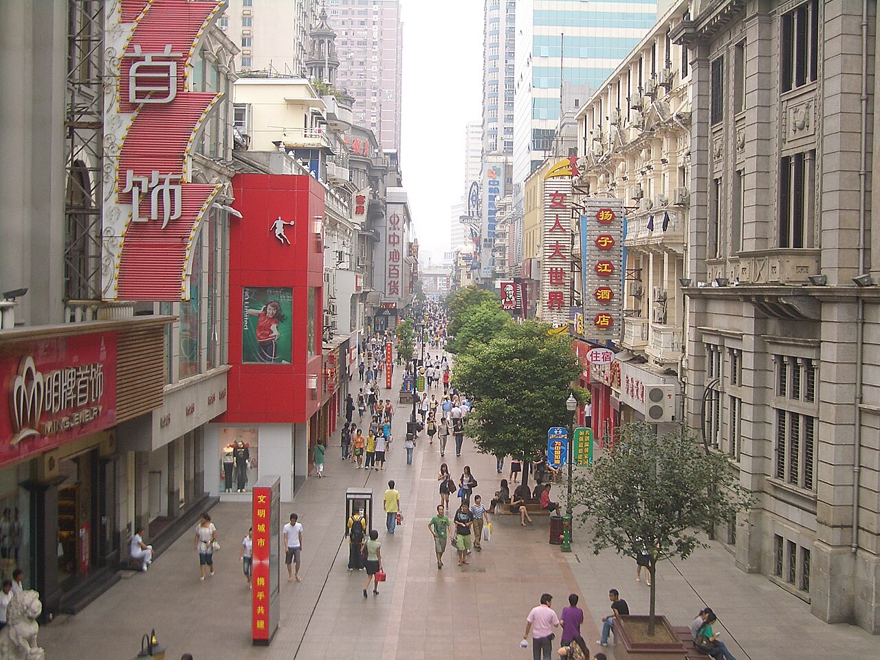Pedestrians on Jianghan Road among early twentieth-century commercial buildings, Hankou