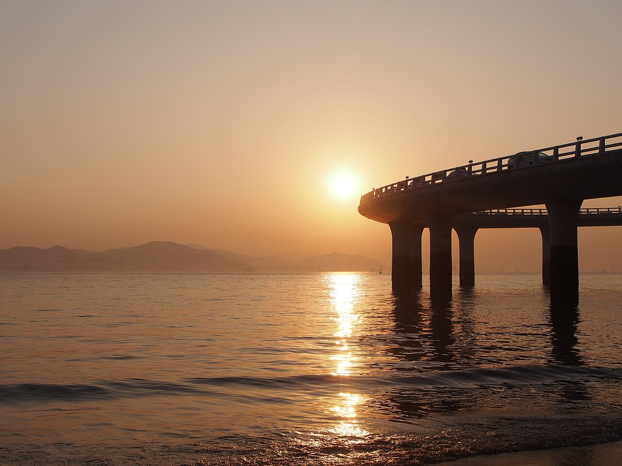 Sunset over the sea beside Yanwu Bridge in Xiamen